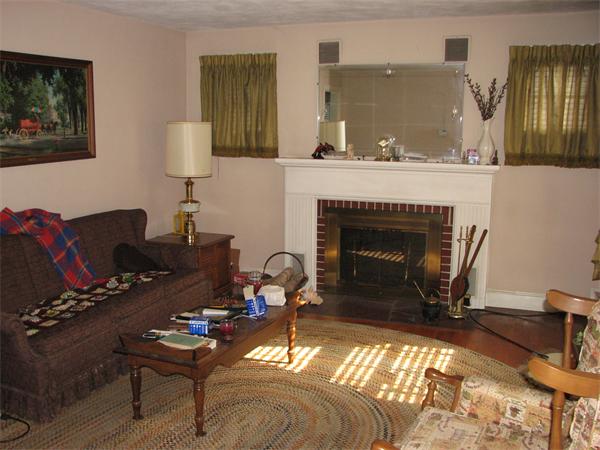 68 Montgomery Street Springfield, MA 01151 - Photo 3 of 15 a living room with furniture a lamp and a fireplace