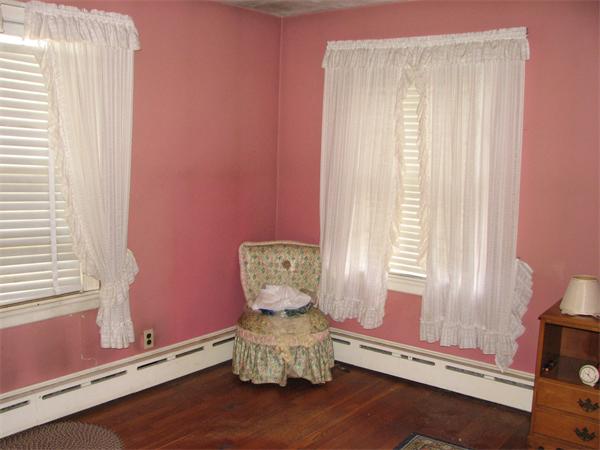 68 Montgomery Street Springfield, MA 01151 - Photo 5 of 15 a room with chair and windows