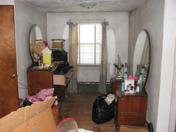 68 Montgomery Street Springfield, MA 01151 - Photo 8 of 15 a living room with furniture and a mirror