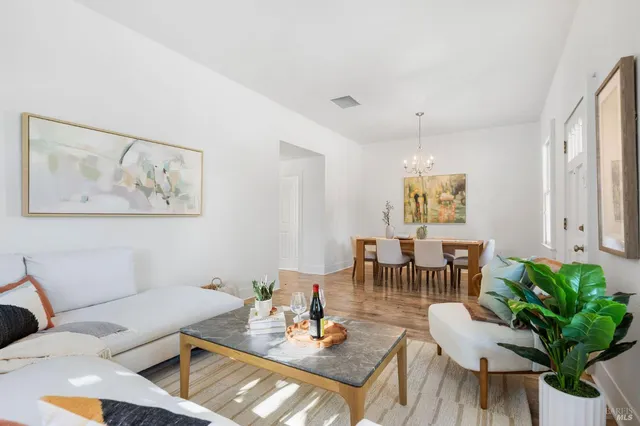 a view of a workspace with furniture and window