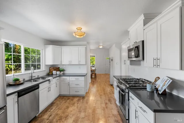 a work room with furniture and a wooden floor