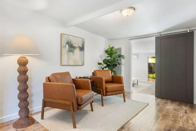 a backyard of a house with a slide and swing