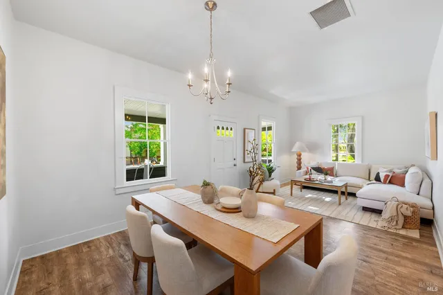 a kitchen with a sink window and cabinets