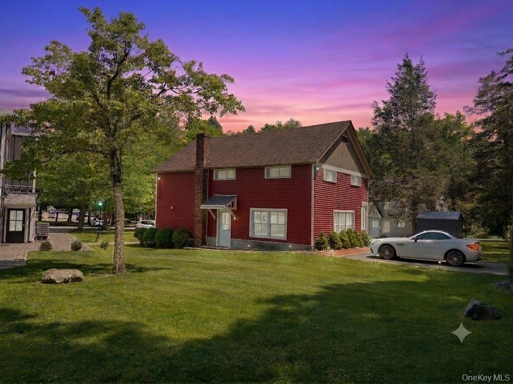 4 Lower Trinity Pass Road Pound Ridge, NY 10576 - Photo 29 of 29 a front view of a house with a garden