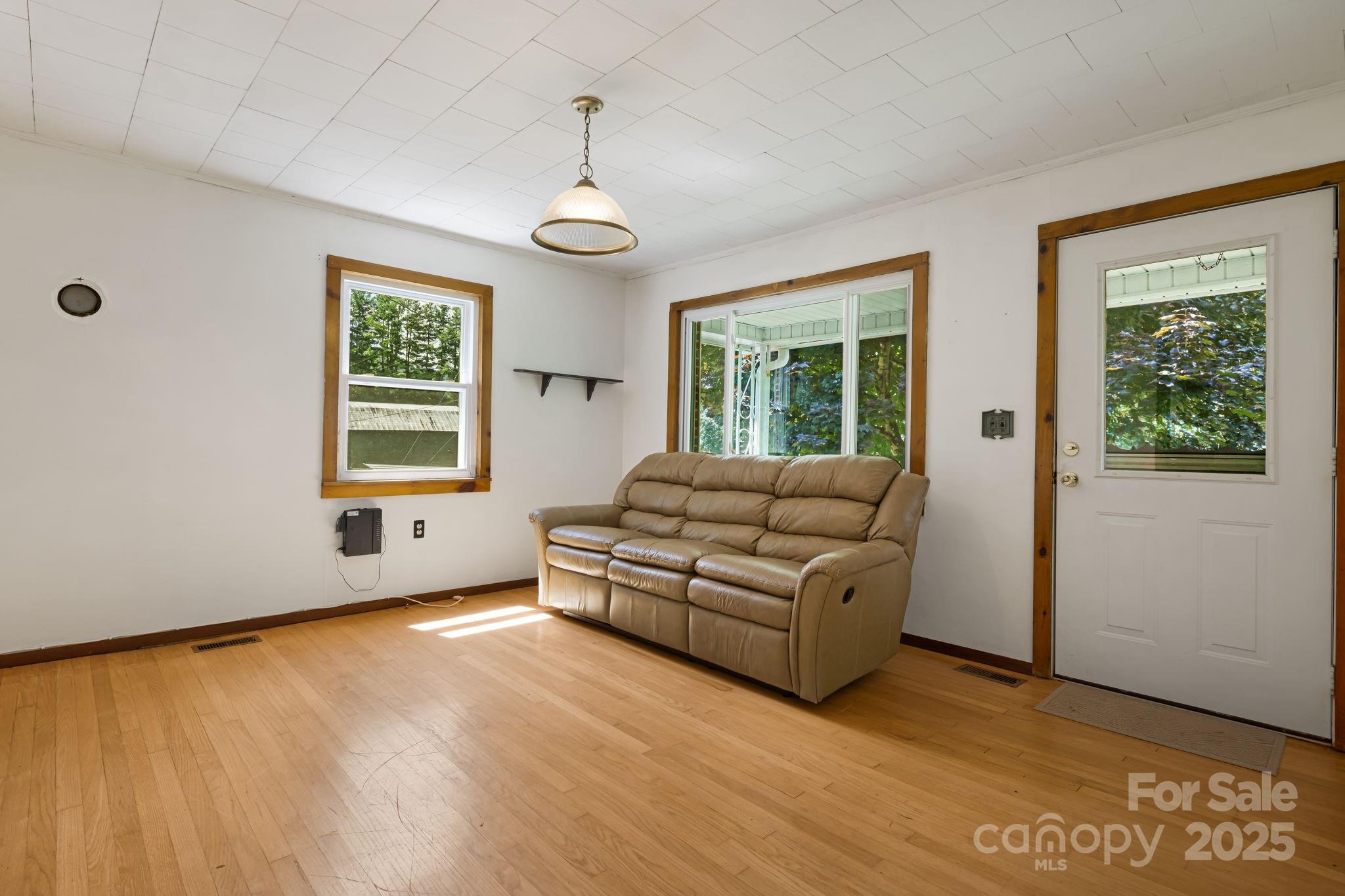 474 Smith Creek Road Mars Hill, NC 28754 - Photo 13 of 27 a living room with furniture and a large window