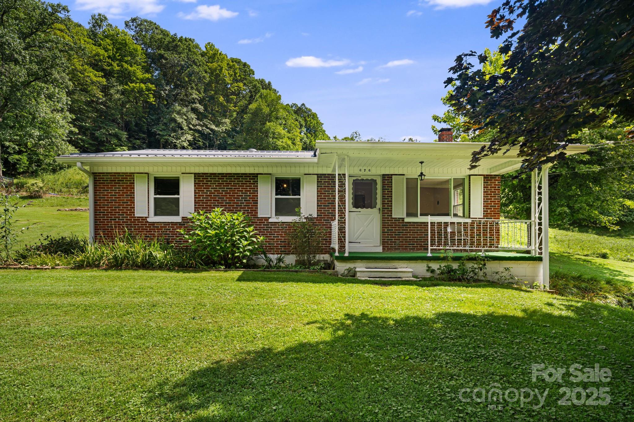 474 Smith Creek Road Mars Hill, NC 28754 - Photo 2 of 27 a front view of a house with a yard