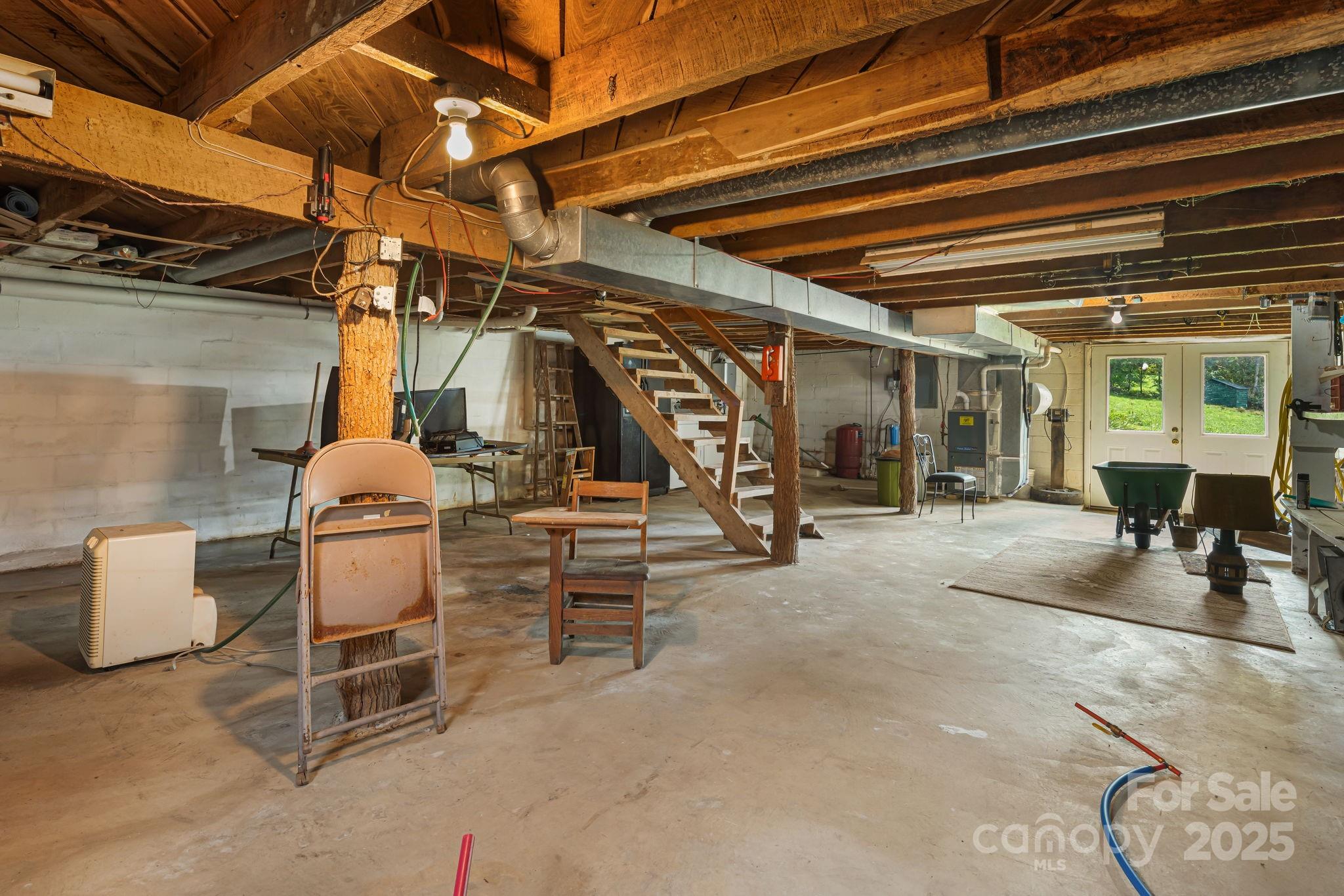 474 Smith Creek Road Mars Hill, NC 28754 - Photo 23 of 27 a view of a garage with table and chairs
