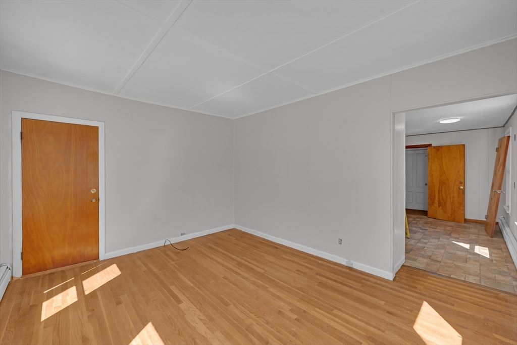 47 Morris Street Southbridge, MA 01550 - Photo 4 of 40 a view of empty room with wooden floor