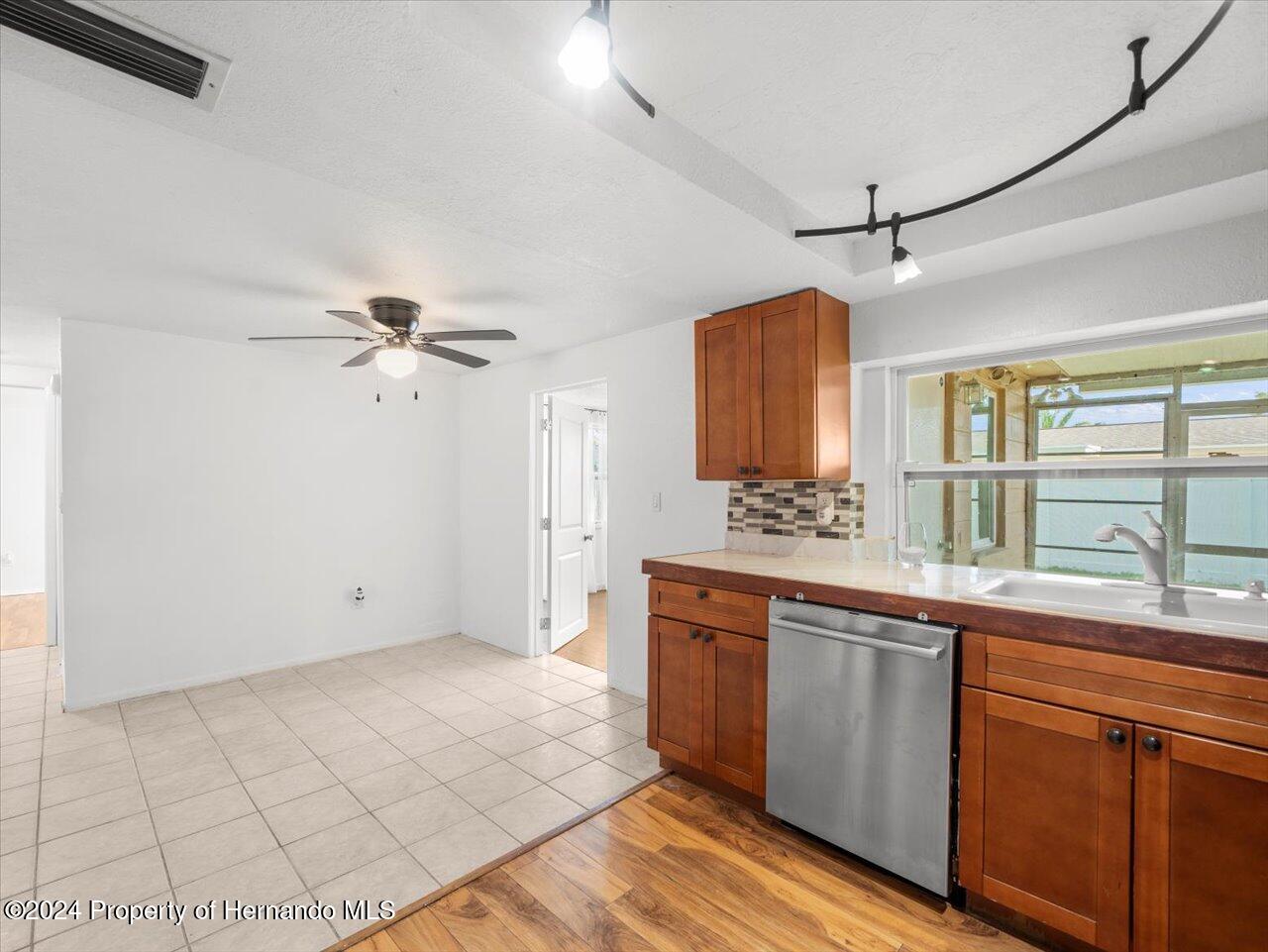 3902 Glissade Drive New Port Richey, FL 34652 - Photo 20 of 39 a view of a kitchen with a sink and a window
