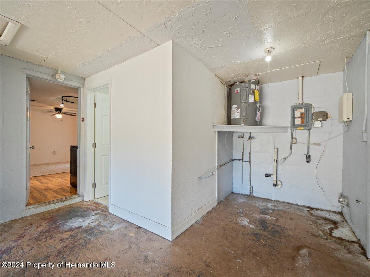 3902 Glissade Drive New Port Richey, FL 34652 - Photo 24 of 39 a view of a storage & utility room