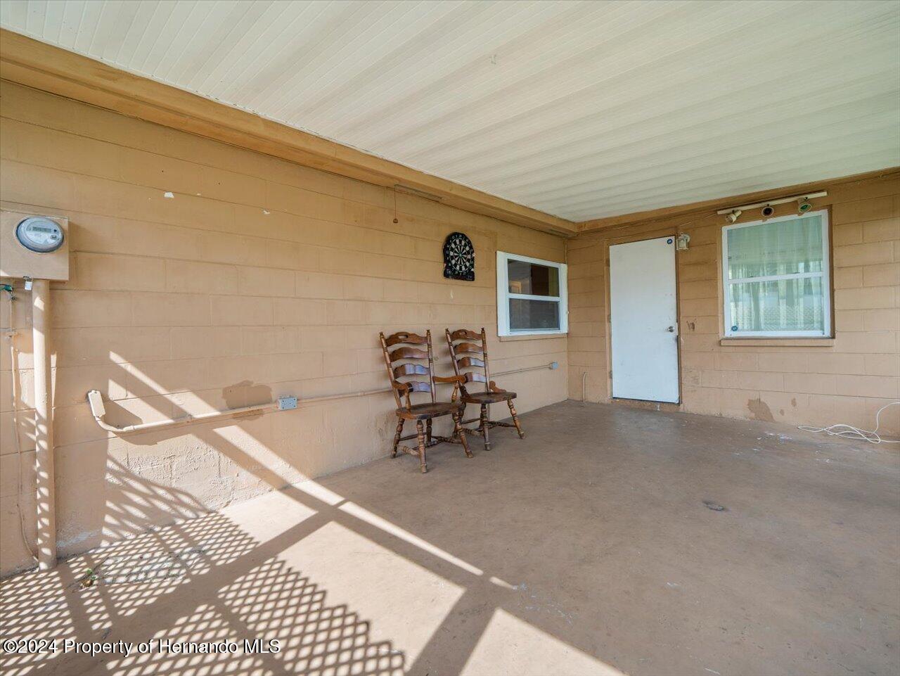 3902 Glissade Drive New Port Richey, FL 34652 - Photo 34 of 39 a dining room with furniture and a window