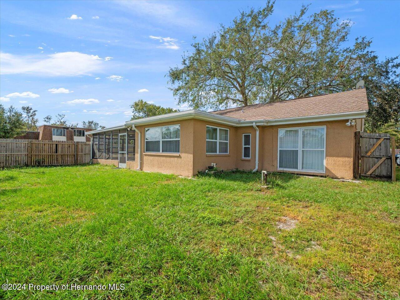 3902 Glissade Drive New Port Richey, FL 34652 - Photo 36 of 39 a view of a house with backyard and garden