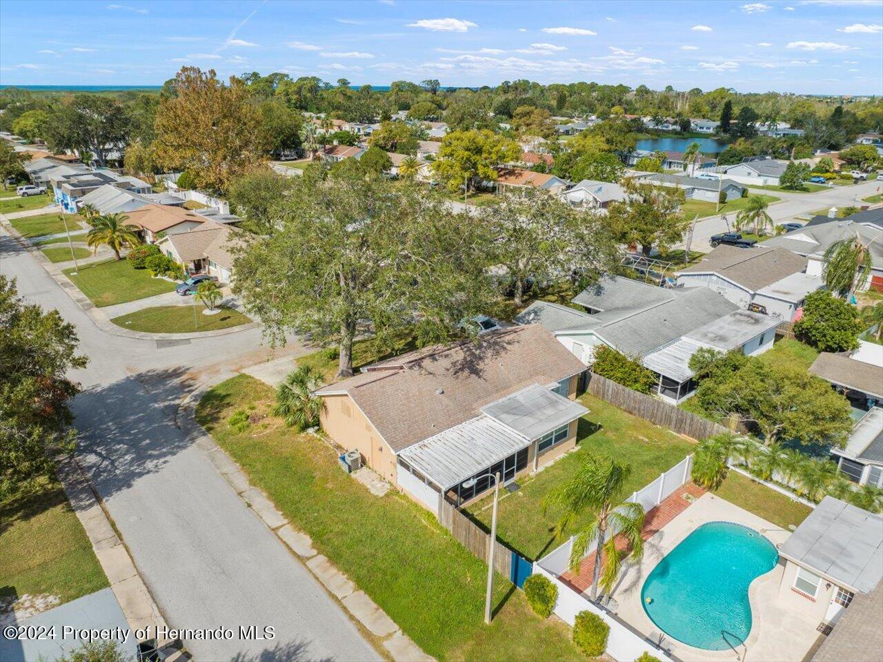 3902 Glissade Drive New Port Richey, FL 34652 - Photo 38 of 39 an aerial view of residential houses with outdoor space