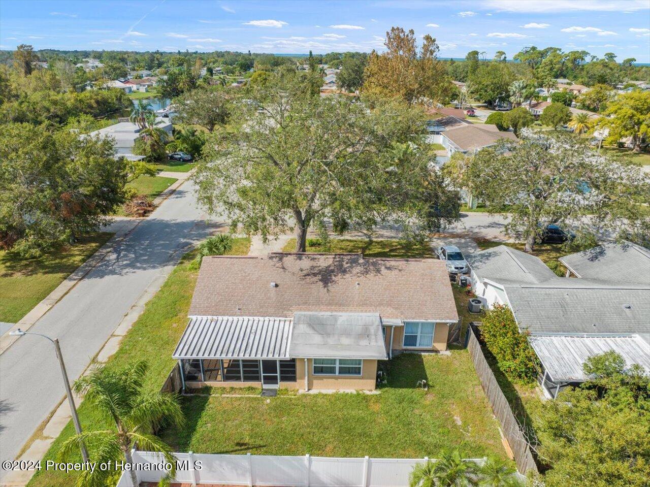 3902 Glissade Drive New Port Richey, FL 34652 - Photo 39 of 39 an aerial view of a house with a swimming pool