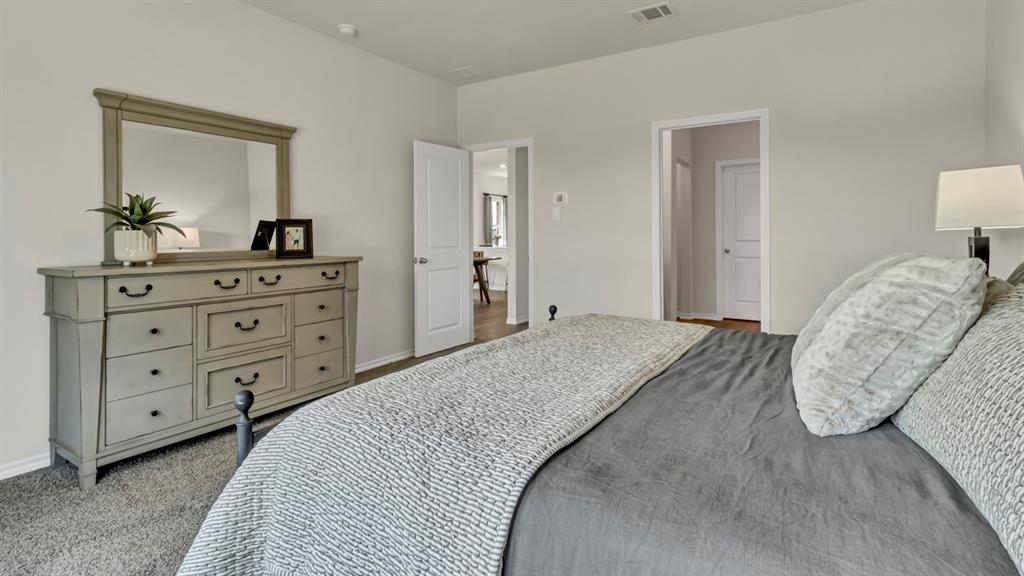124 Pheasant Run Road Terrell, TX 75160 - Photo 28 of 35 Carpeted bedroom with neutral wall paint and white trim