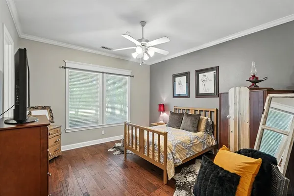 a bedroom with furniture and a window