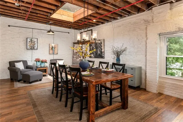 a view of a dining room with furniture and window