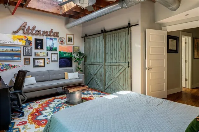 a living room with furniture a rug and a window