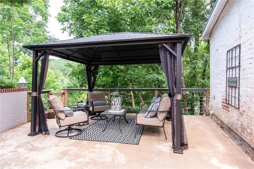 585 White Circle, Unit 402 Athens, GA 30605 - Photo 23 of 37 a view of backyard with deck and outdoor seating