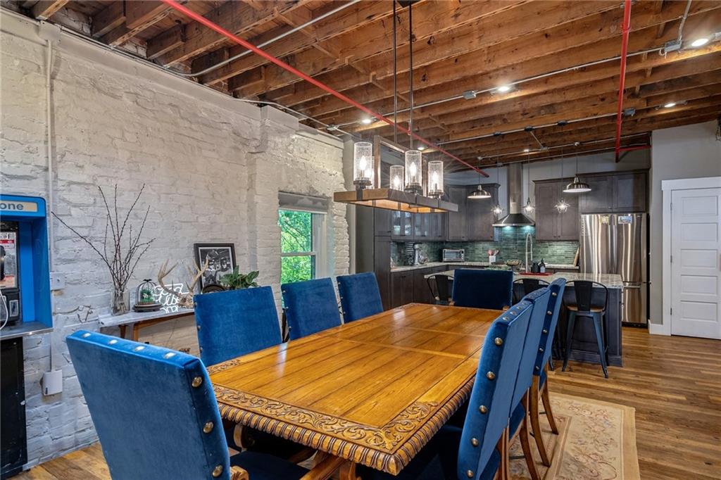 585 White Circle, Unit 402 Athens, GA 30605 - Photo 5 of 37 a dining room with a wooden table and chairs