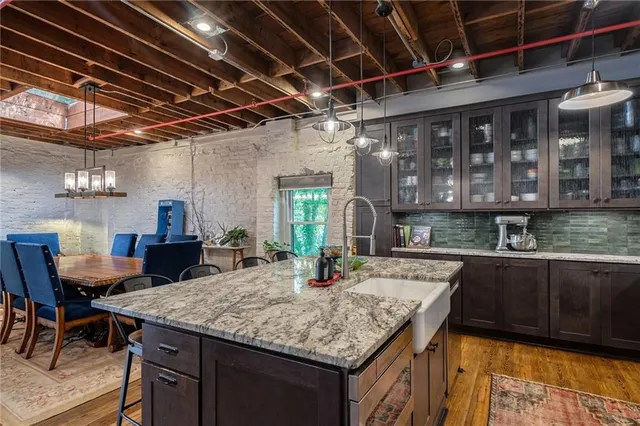 a kitchen with a table and chairs in it