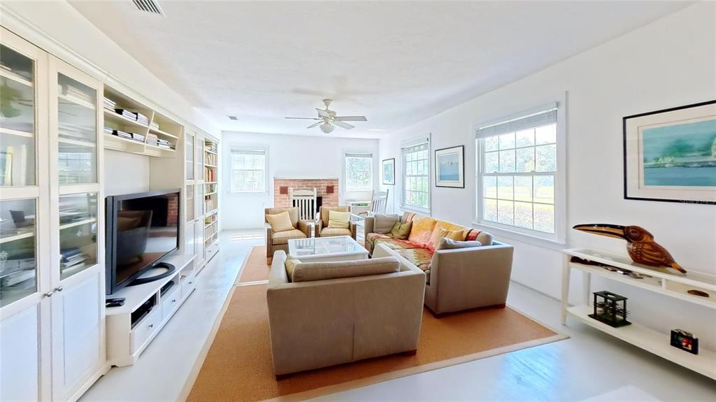 7390 South Mc Alpin Road McAlpin, FL 32062 - Photo 3 of 53 a living room with furniture and a fireplace