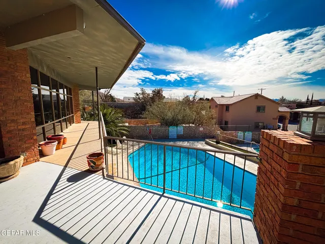 a view of balcony with wooden floor and outdoor seating