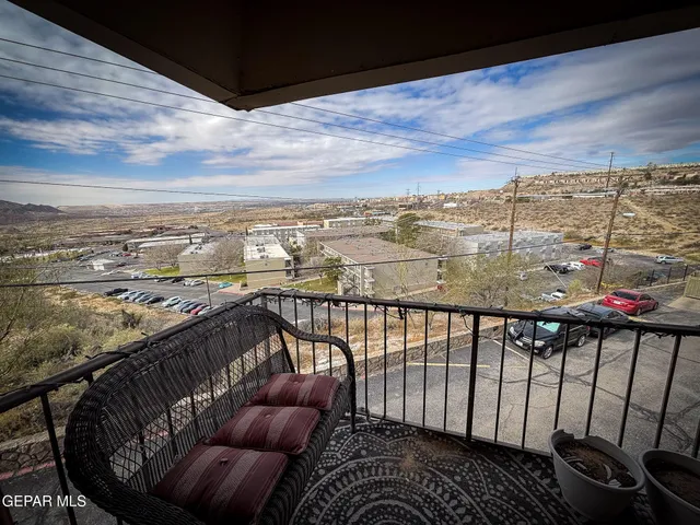 a view of a balcony with city view