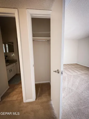 a view of a hallway view with wooden floor and staircase