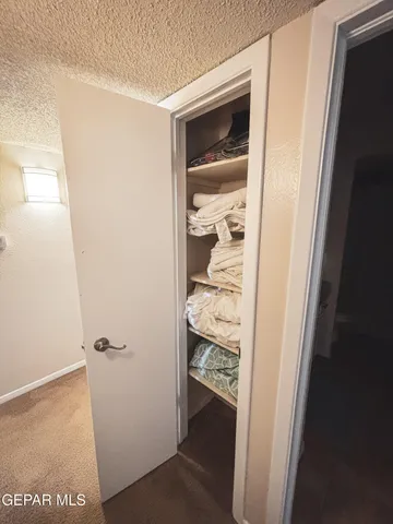 a kitchen with stainless steel appliances granite countertop a refrigerator a stove a sink and a microwave