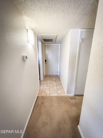 a view of a kitchen area with furniture and a window