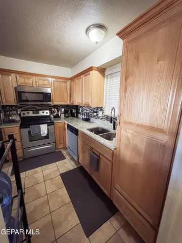 a room with a table chairs and entryway