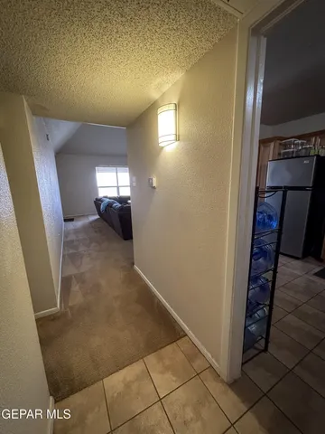 a kitchen with stainless steel appliances kitchen island granite countertop a refrigerator and stove