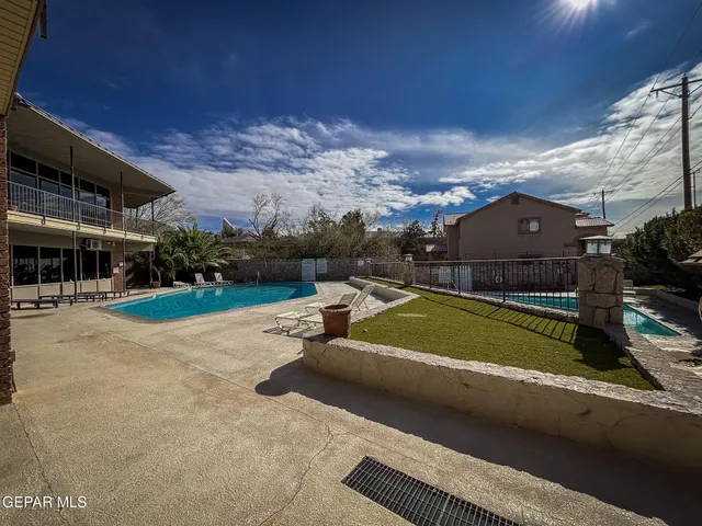 a view of a house with a yard porch and sitting area