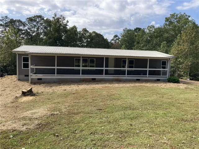 a view of a house with a garden