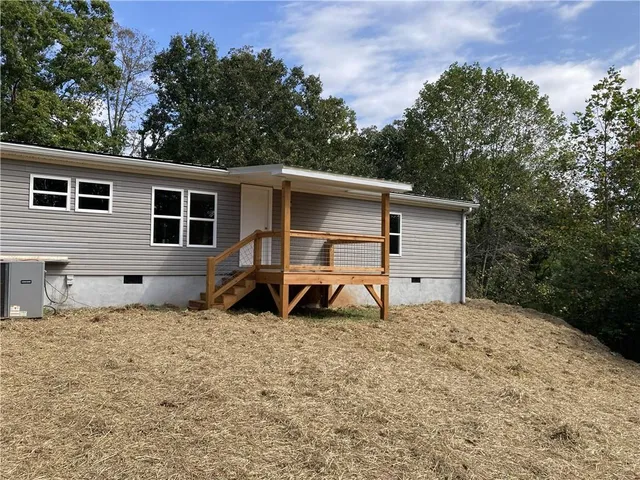 a house view with a backyard space