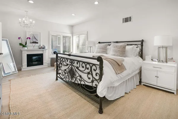 a bathroom with a double vanity sink mirror and shower