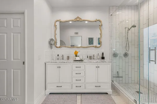 a bedroom with a bed and a desk