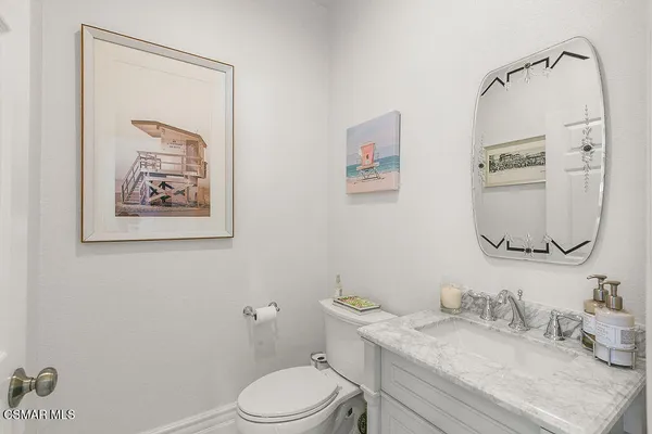a kitchen with a refrigerator sink and stainless steel appliances