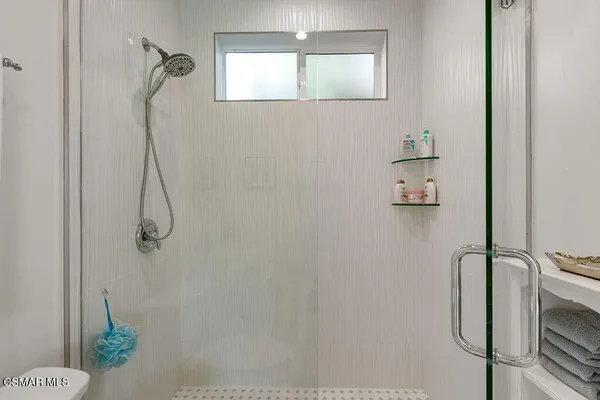 a front view of house with a garden