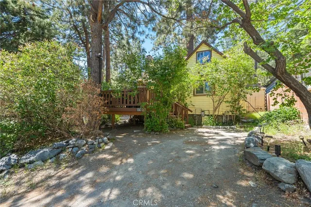 a view of a street with trees and bushes