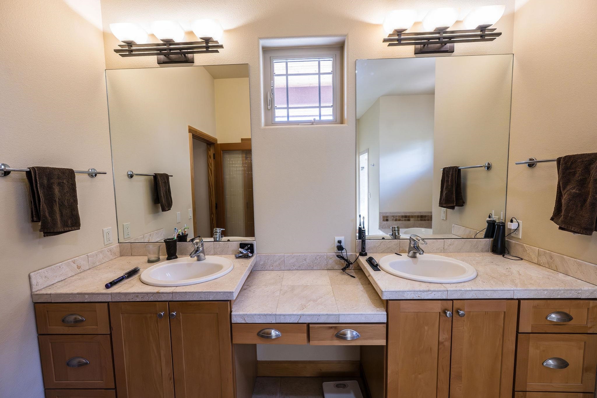 2069 Spur Cross Road Grand Junction, CO 81507 - Photo 12 of 40 a bathroom with a sink and a mirror