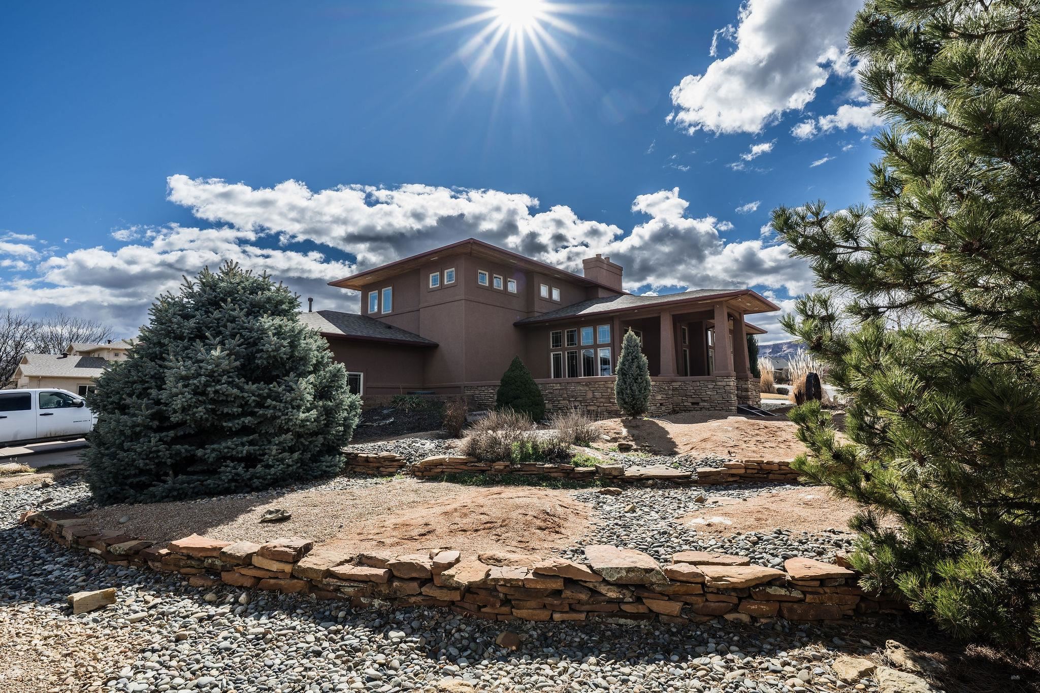 2069 Spur Cross Road Grand Junction, CO 81507 - Photo 2 of 40 a view of a house with a yard