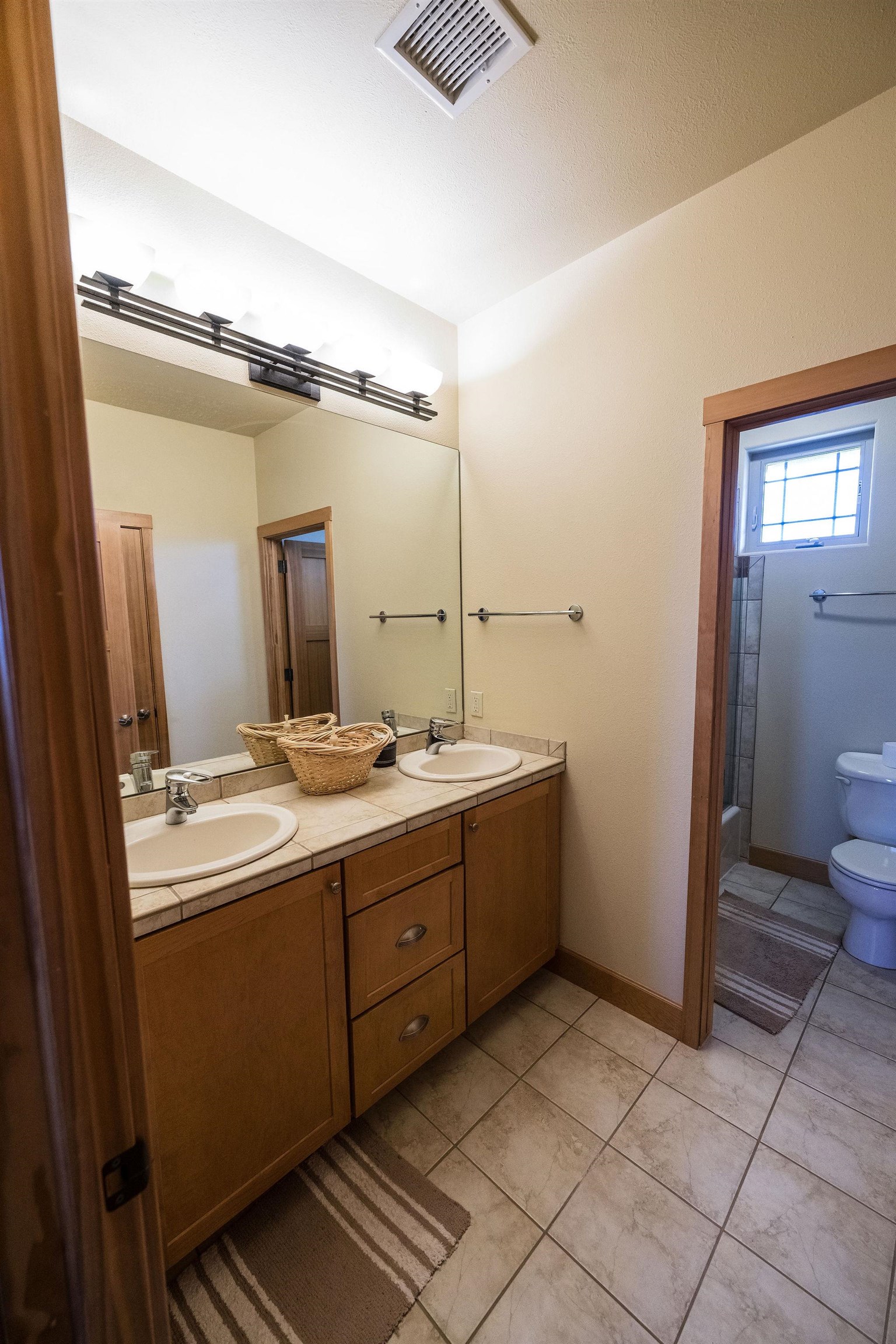2069 Spur Cross Road Grand Junction, CO 81507 - Photo 22 of 40 a bathroom with a sink and a mirror