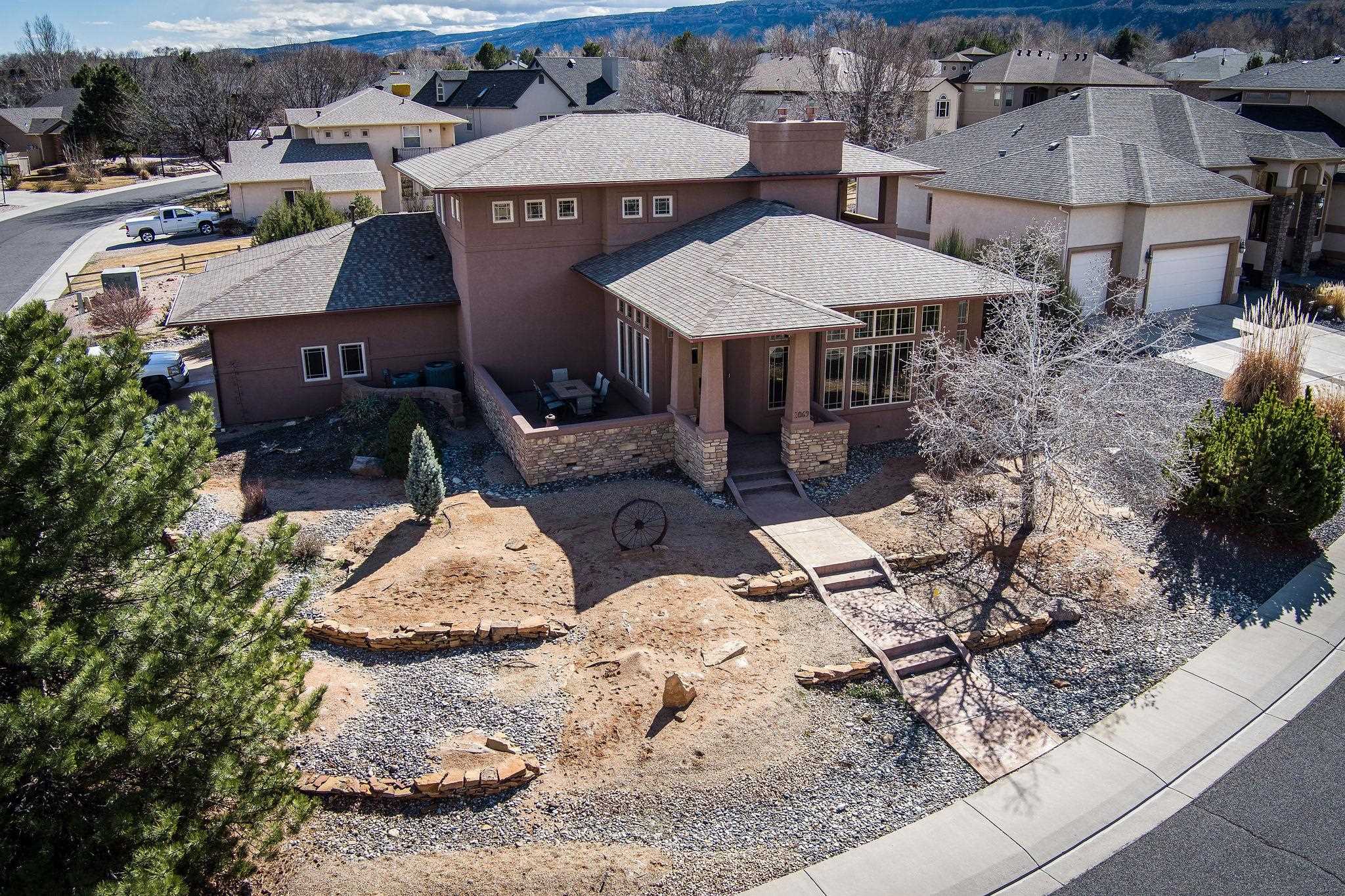 2069 Spur Cross Road Grand Junction, CO 81507 - Photo 33 of 40 an aerial view of a house with yard and patio