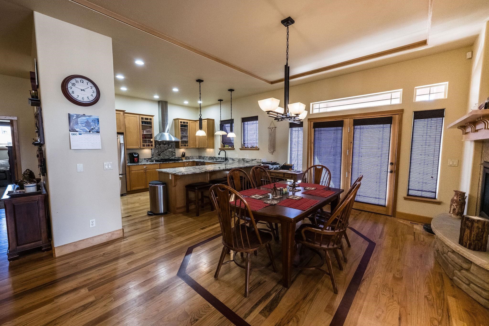 2069 Spur Cross Road Grand Junction, CO 81507 - Photo 6 of 40 a view of a dining area with furniture and wooden floor