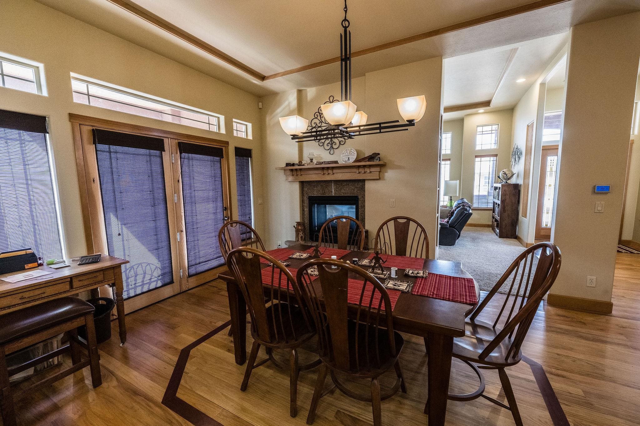 2069 Spur Cross Road Grand Junction, CO 81507 - Photo 7 of 40 a view of a dining room with furniture chandelier
