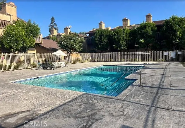 a bathroom with a toilet and a shower curtain