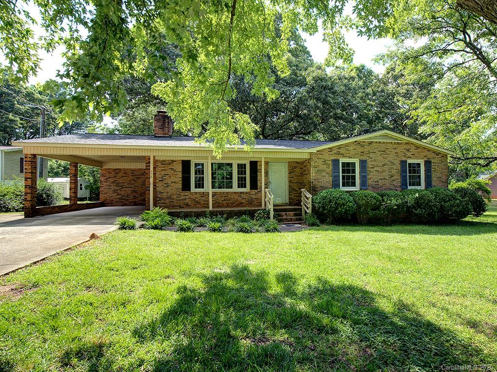858 State Rd S-29-376 Lancaster, SC 29720 - Photo 1 of 28 a front view of a house with a yard and porch