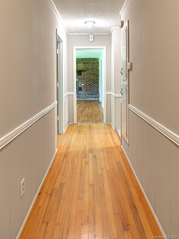 858 State Rd S-29-376 Lancaster, SC 29720 - Photo 14 of 28 a view of a hallway with wooden floor